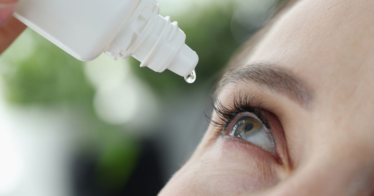 Woman Dripping into Her Eyes with Antibacterial Drops