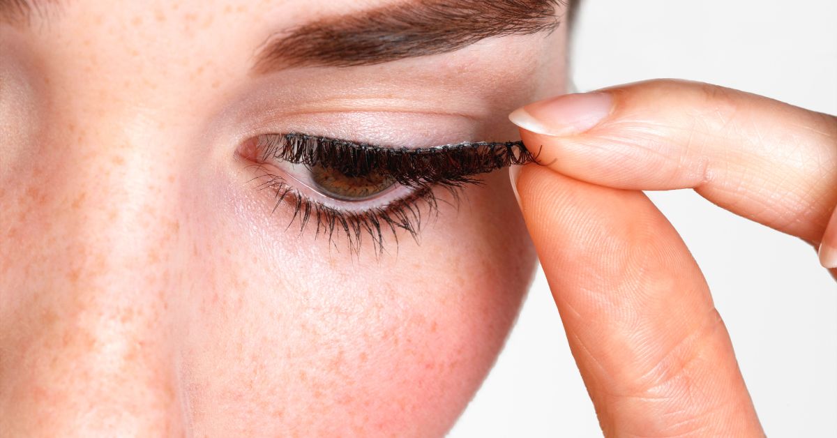 Woman Removing Eyelash extensions